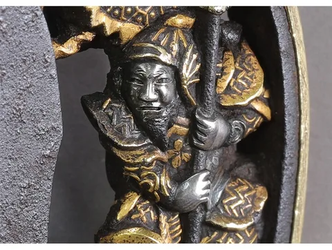 Detalle de Tsuba · Okamoto Naoshige (Tetsugendō)